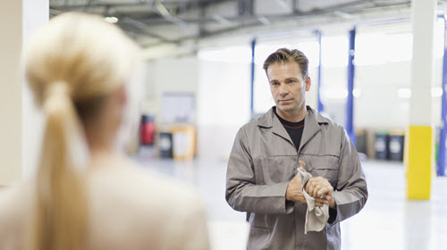 Car Mechanic & Owner Maintaining Social Distancing